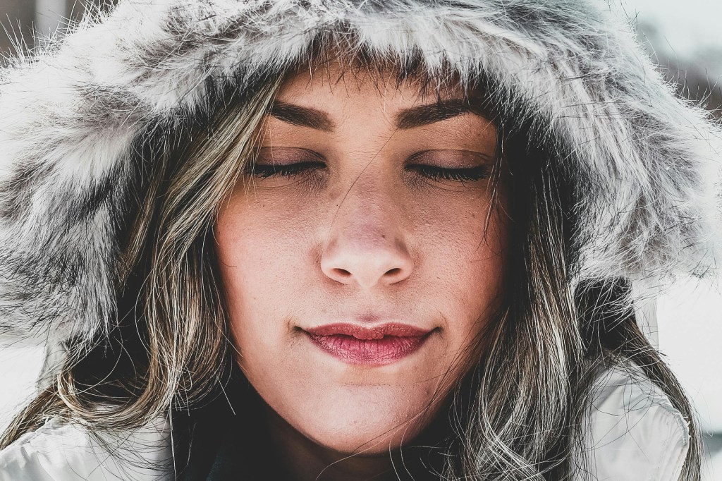 Woman standing still in self-reflection
