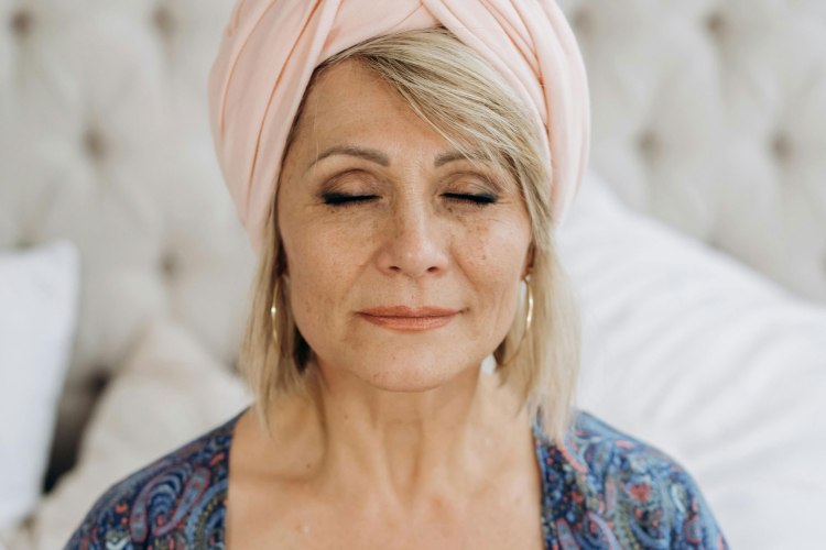 Midlife woman meditating