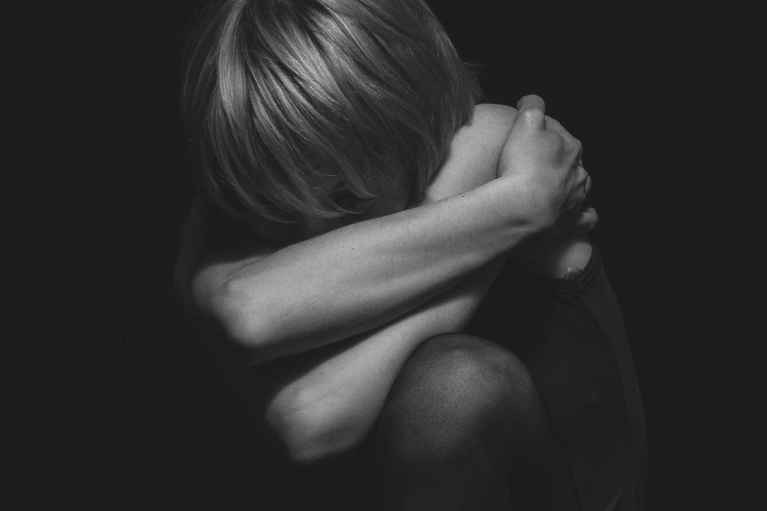 Woman embracing herself